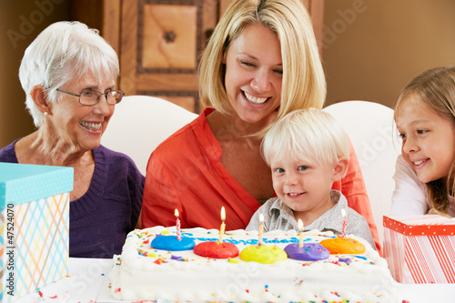 Photo: Family Celebrating Children's Birthday With Grandmother Family Celebrating Children's Birthday With Grandmother