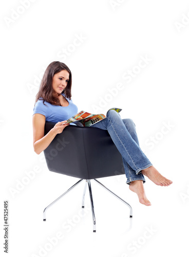 Photo: Casual 20s women sitting and reading in a magazine 2 Casual 20s women sitting and reading in a magazine 2