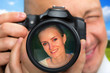 Photographer capturing portrait of beautiful woman