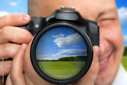 Photo: Photographer capturing rural landscape Photographer capturing rural landscape