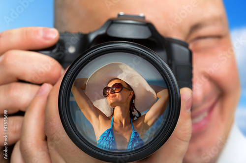 Photo: Photographer capturing portrait of bikini girl Photographer capturing portrait of bikini girl