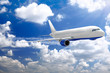 Airplane in a sky with clouds.