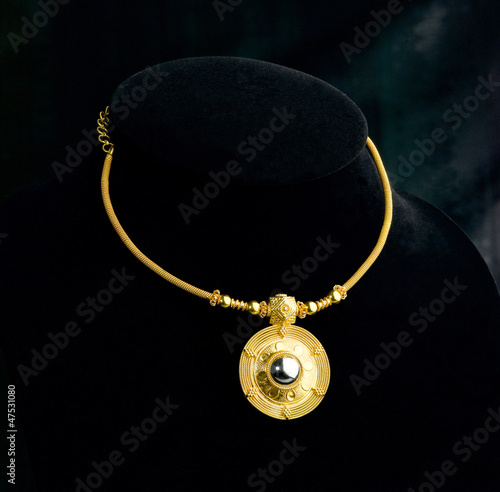 Photo: Luxury golden necklace and pendant in Thai ancient style Luxury golden necklace and pendant in Thai ancient style