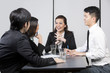 Chinese Business team having a meeting.