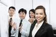 Photo: Chinese business team clapping. Chinese business team clapping.