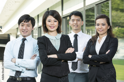 Photo: Chinese Business woman with her team. Chinese Business woman with her team.