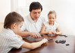 Foto: Family that plays dominoes Family that plays dominoes