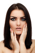 Beautiful glamour brunette with hands on face