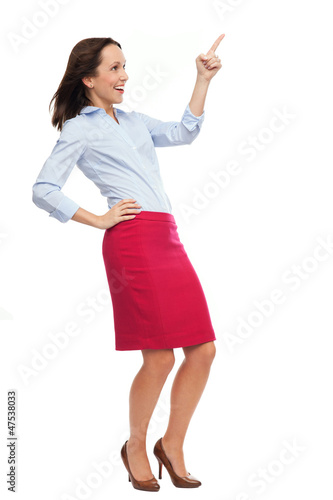 Photo: Business woman pointing up Business woman pointing up