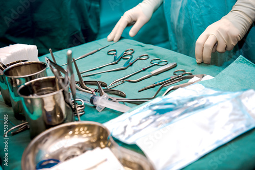 Photo: Surgeon and surgical tools closeup Surgeon and surgical tools closeup