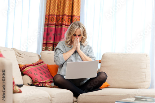 Photo: attractive woman with laptop in home attractive woman with laptop in home