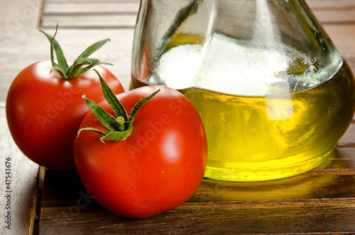 Photo: Tomatoes and extra virgen olive oil Tomatoes and extra virgen olive oil
