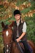 Young girl riding a horse