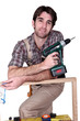 Man with hand drill