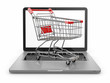 E-commerce. Shopping cart on laptop.