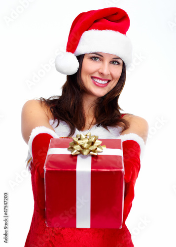 Photo: Santa helper Christmas girl with a present. Santa helper Christmas girl with a present.