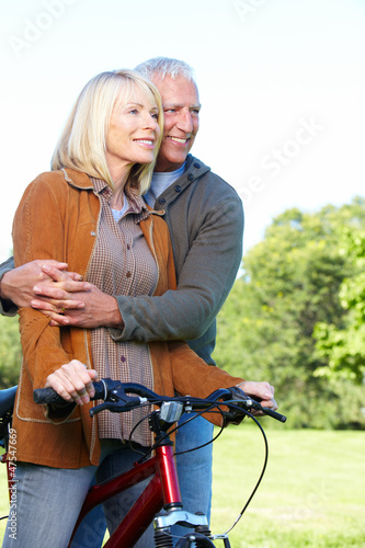 Photo: Happy senior couple cyclist. Happy senior couple cyclist.