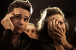 Couple scared at the cinema, watching horror movie