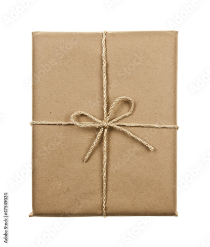 Photo: Gift in brown paper tied with string Gift in brown paper tied with string