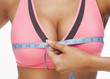 woman measures a bust