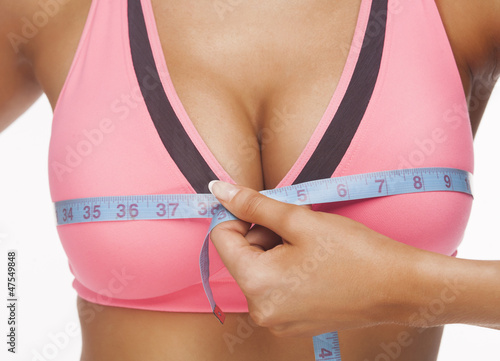 Photo: woman measures a bust woman measures a bust