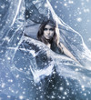 A young woman in a dress on a snowy blue silk background