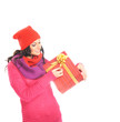 A young woman in warm red clothes holding a present