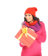 A young woman in warm red clothes holding a present
