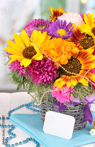 Photo: Beautiful bouquet of bright flowers with paper note close-up Beautiful bouquet of bright flowers with paper note close-up