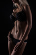 female body in black linen