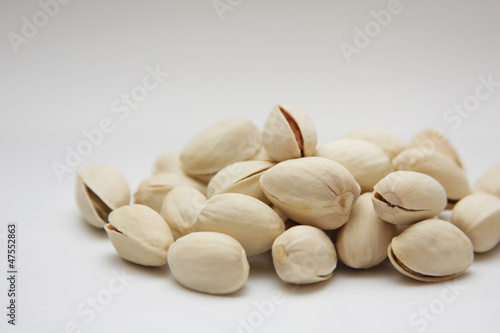 Photo: Pistachios on a light background Pistachios on a light background