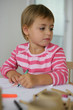 Photo: Little girl coloring in Little girl coloring in