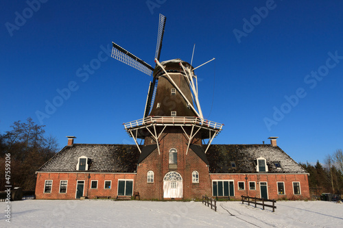 Photo: Dutch windmill in in winter. Dutch windmill in in winter.