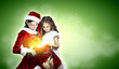 Little girl with christmas gifts and santa