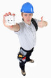 A young electrician showing an outlet.
