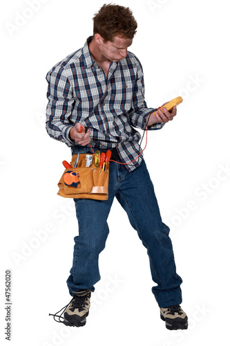 Photo: Landscape picture of electrician with voltmeter Landscape picture of electrician with voltmeter
