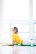 Foto: Pretty young woman doing YOGA exercise at home Pretty young woman doing YOGA exercise at home