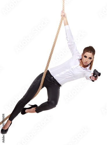 Photo: Sexy girl holding a black gun Sexy girl holding a black gun
