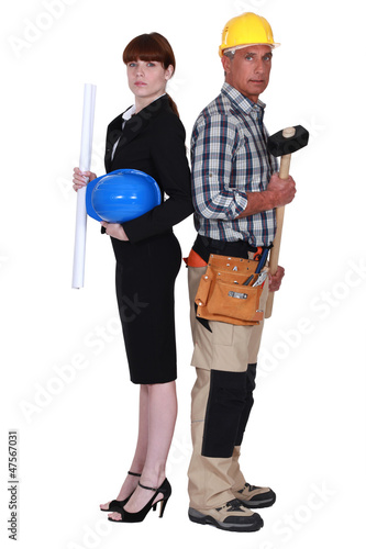 Photo: Female architect stood with chief builder Female architect stood with chief builder