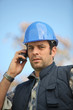 foreman in construction site making a call