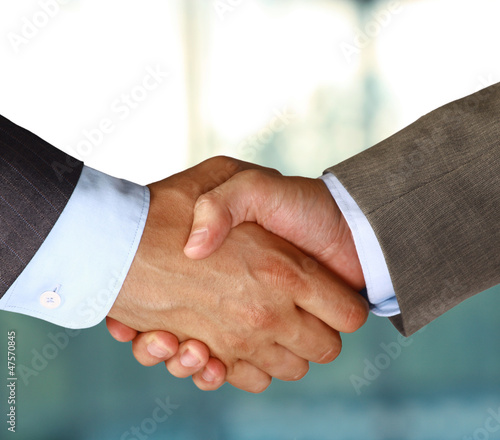 Photo: Two businessman shaking hands Two businessman shaking hands