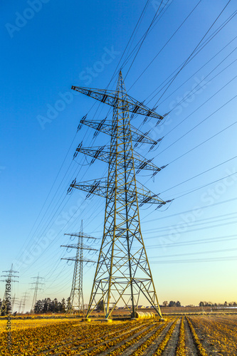 Photo: hight voltage tower in rural landscape with blue sky hight voltage tower in rural landscape with blue sky