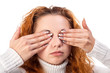 woman covering her eyes by the hands,
