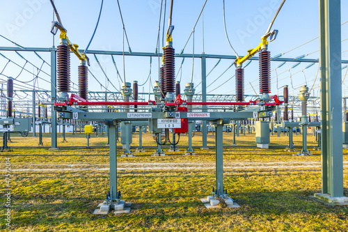 Photo: hight voltage tower in rural landscape with blue sky hight voltage tower in rural landscape with blue sky