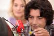 Man repairing television
