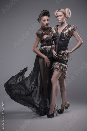 Photo: two beautiful caucasian women in gorgeous dress two beautiful caucasian women in gorgeous dress