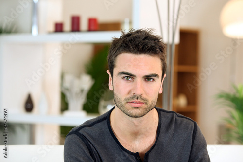 Photo: Bachelor sat on sofa Bachelor sat on sofa