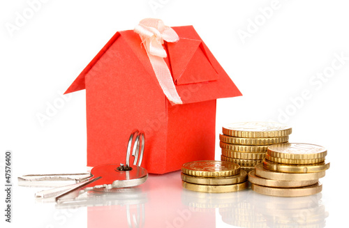 Photo: Small house with money and key isolated on white Small house with money and key isolated on white