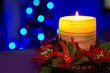 Christmas candles with blurry lights on background