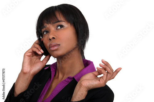 Photo: Businesswoman talking on her mobile phone Businesswoman talking on her mobile phone